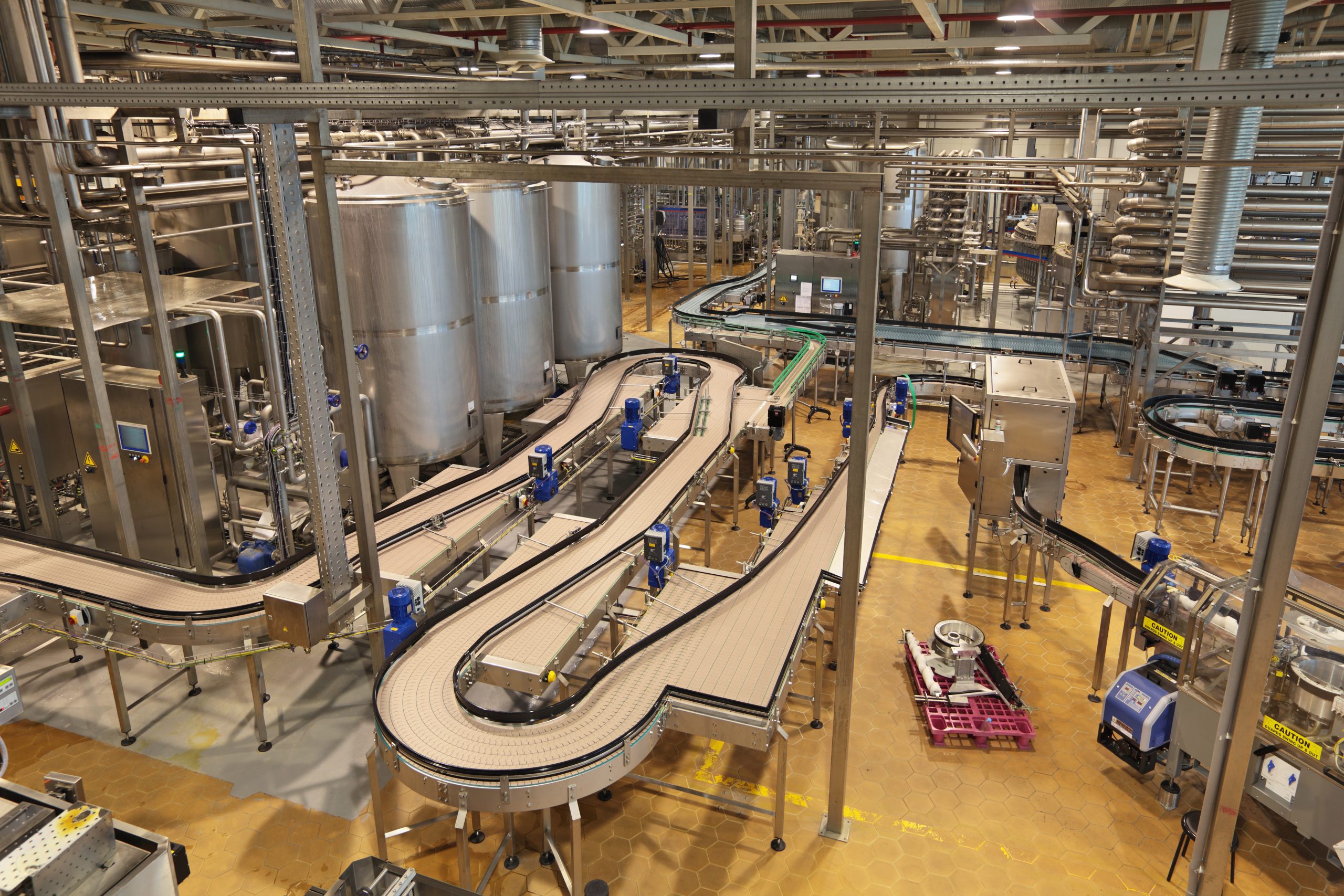 The interior of the brewery. The conveyor line for bottling of beer at a large warehouse. PAR4012 Series Spec Sheet | Ultrasonic Transducers Use in Food| Parsonicscorp.com | 815.338.6509